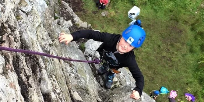 Rock climbing kid nearly at the top-Sligo-Ireland