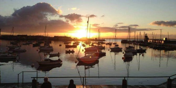 howth-sundown-cruise-serene-howth-harbour-at-sunsetvivid-skies-and-peaceful-waters-from-the-boat-dublin-ireland