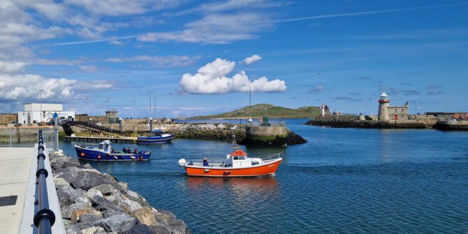 howth-coastal-boat-tour-serene-views-of-howth-harbor-with-lighthouses-and-scenic-boats-dublin-ireland