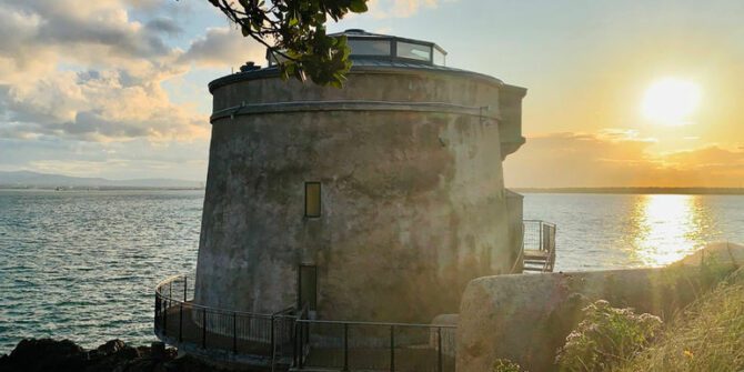 panoramic-ebike-tour-sunset-magic-at-a-historic-coastal-tower-during-the-panoramic-ebike-tour-dublin-ireland