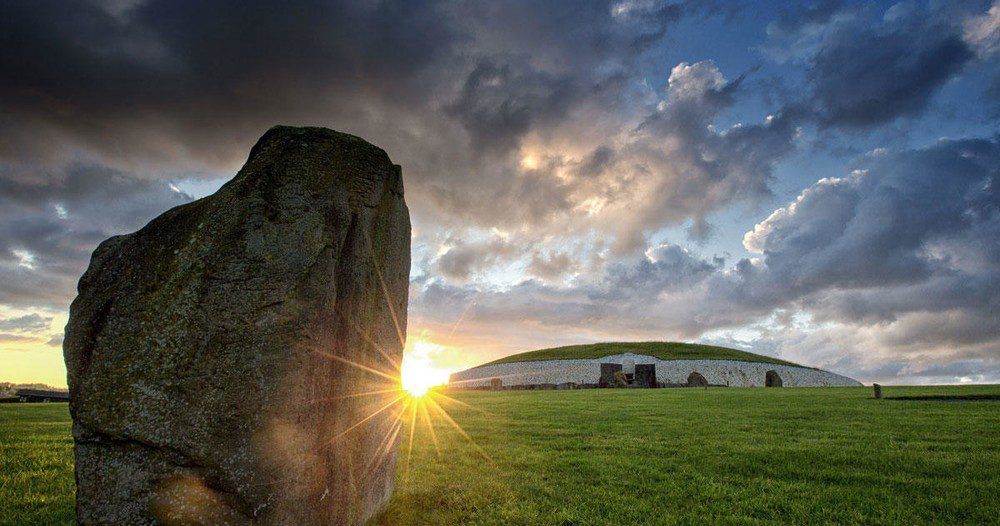 winter solstice sunrise at Newgrange, a prehistoric monument in County Meath, Ireland