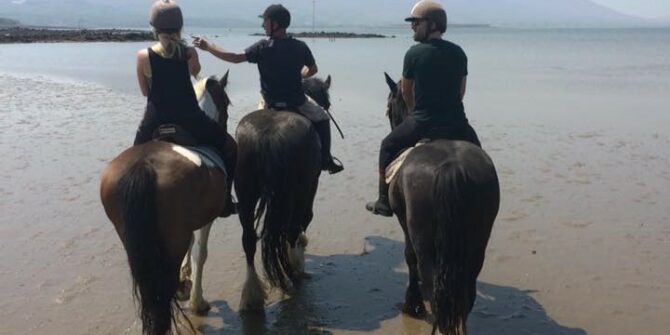 Beach horse riding Clew Bay looking at Croagh Patrick County Mayo Ireland